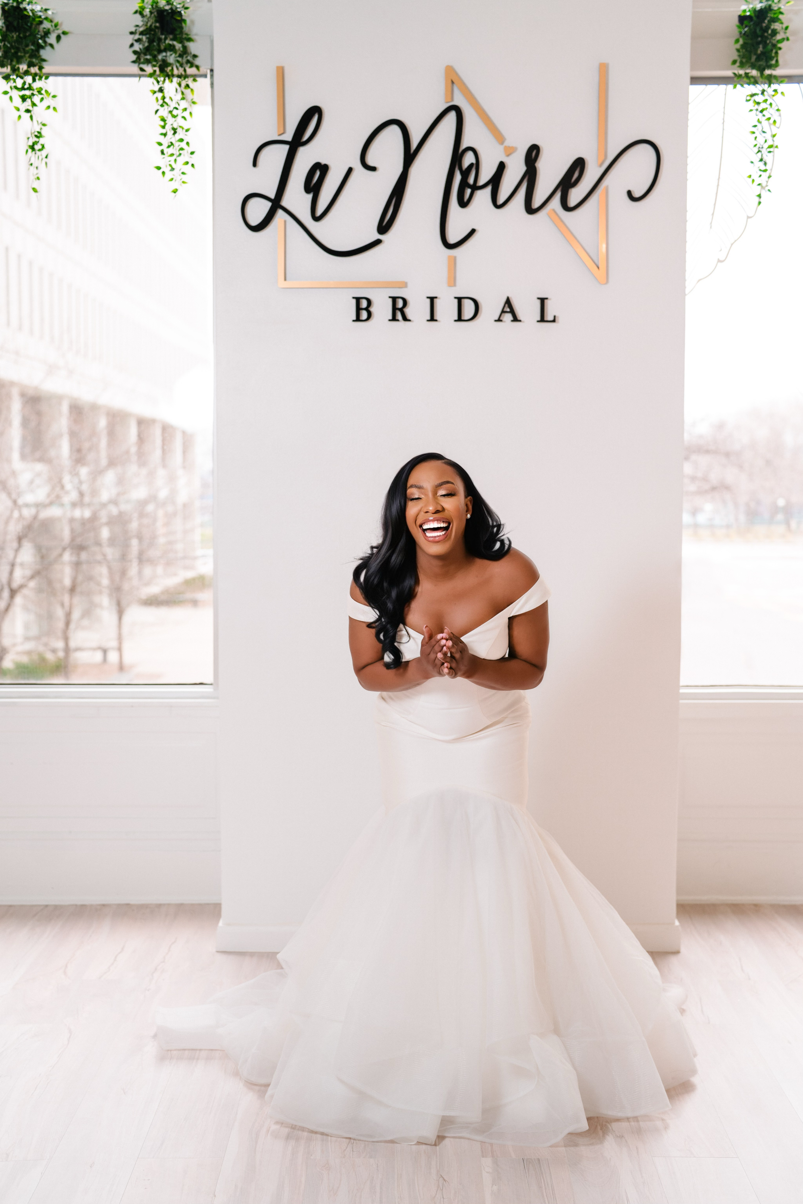 A bride at LaNoire Bridal finding her perfect gown